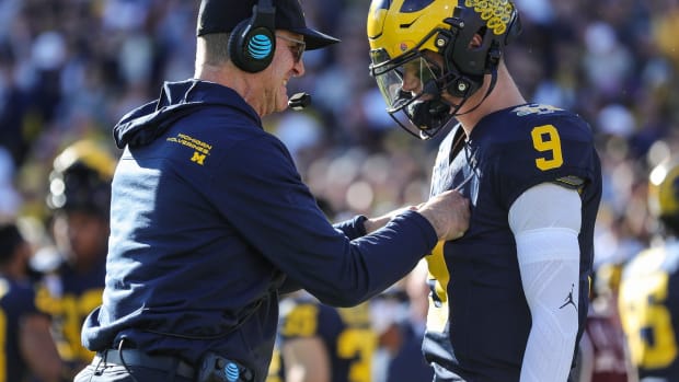 Michigan coach Jim Harbaugh talks to quarterback J.J. McCarthy before the start of the Rose Bowl vs. Alabama in Pasadena, California, on Monday, Jan. 1, 2024 